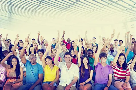 A group of people sitting in front of each other.